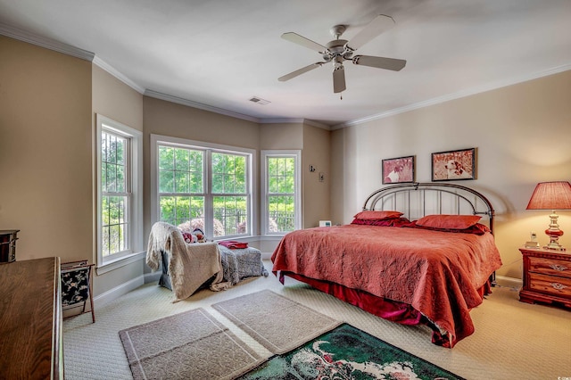 bedroom featuring crown molding, baseboards, visible vents, and carpet