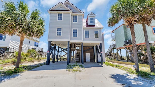 324 S Waccamaw Dr, Garden City Beach, SC 29576 - beach home with driveway, stairway, and a carport