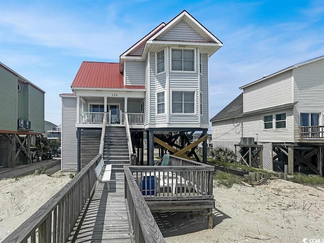 324 S Waccamaw Dr, Garden City Beach, SC 29576 - rear view of property featuring a porch, metal roof, and stairs
