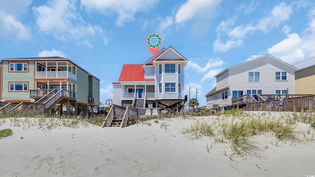 324 S Waccamaw Dr, Garden City Beach, SC 29576 - back of house with metal roof