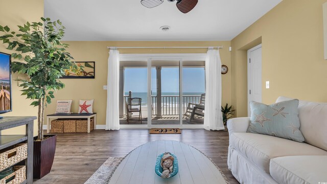 324 S Waccamaw Dr, Garden City Beach, SC 29576 - living room with wood finished floors, visible vents, ceiling fan, a water view, and baseboards