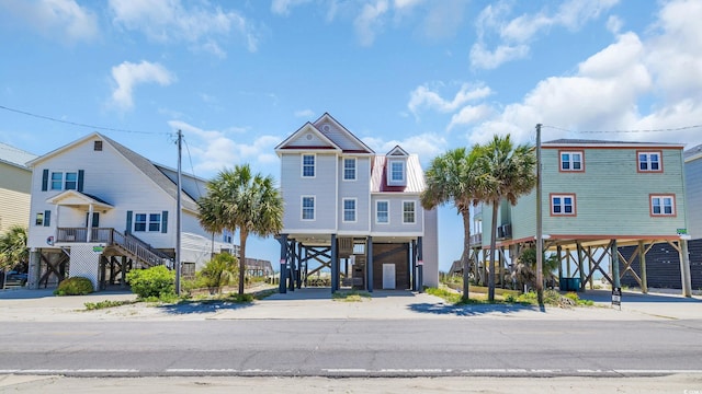 324 S Waccamaw Dr, Garden City Beach, SC 29576 - view of front of home with driveway, a carport, and stairs