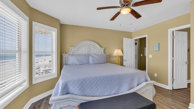 324 S Waccamaw Dr, Garden City Beach, SC 29576 - bedroom with wood finished floors, baseboards, and ceiling fan