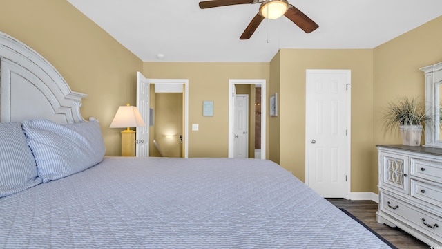 324 S Waccamaw Dr, Garden City Beach, SC 29576 - bedroom with dark wood finished floors, baseboards, and a ceiling fan