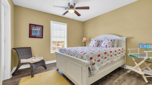 324 S Waccamaw Dr, Garden City Beach, SC 29576 - bedroom with a ceiling fan, wood finished floors, and baseboards