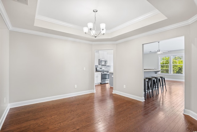 dining area with crown molding, a raised ceiling, and dark wood-style flooring