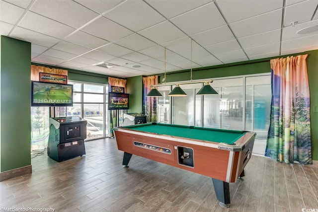 game room featuring wood finished floors, a paneled ceiling, and billiards