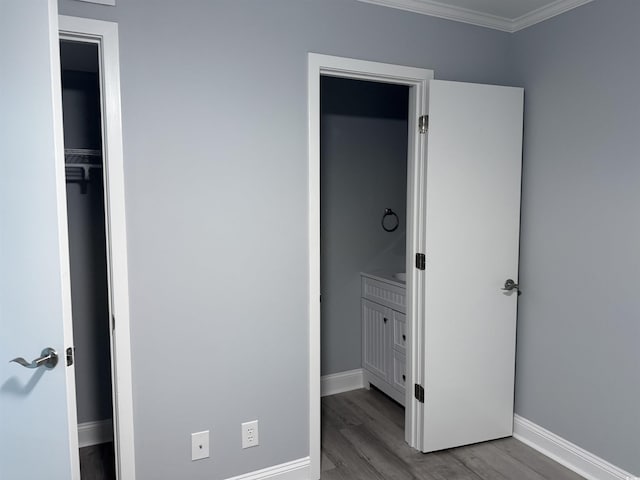 4350 Intercoastal Dr Unit 2302, Little River, SC 29566 - unfurnished bedroom with baseboards, wood finished floors, and crown molding