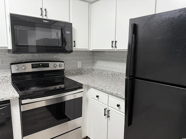4350 Intercoastal Dr Unit 2302, Little River, SC 29566 - kitchen featuring black appliances, white cabinets, tasteful backsplash, and light stone countertops