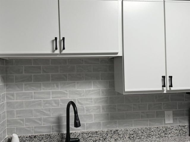 4350 Intercoastal Dr Unit 2302, Little River, SC 29566 - kitchen view of white cabinets, light stone counters, and tasteful backsplash