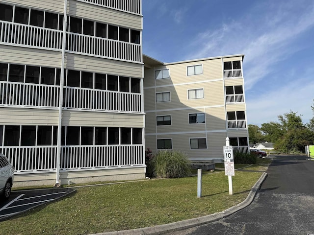 4350 Intercoastal Dr Unit 2302, Little River, SC 29566 - view of building exterior with uncovered parking