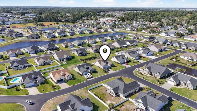 bird's eye view with a residential view and a water view