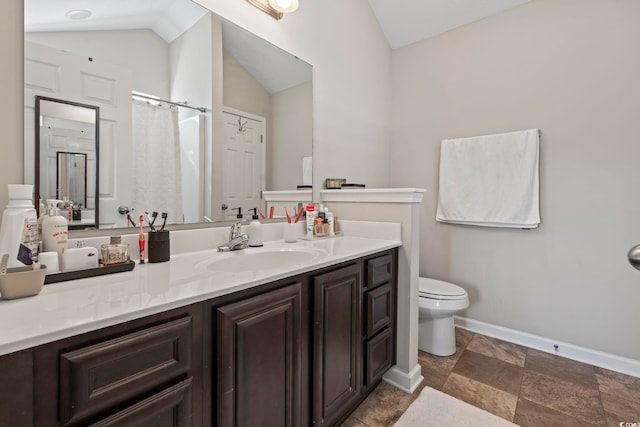 bathroom featuring vanity, toilet, baseboards, stone finish flooring, and lofted ceiling