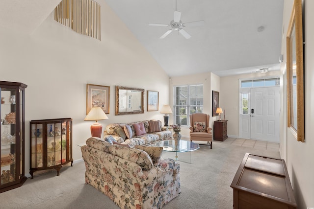 carpeted living area featuring high vaulted ceiling, ceiling fan, and baseboards