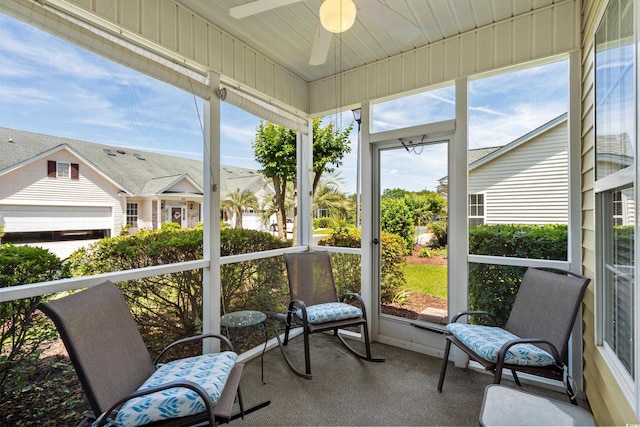 sunroom with a ceiling fan