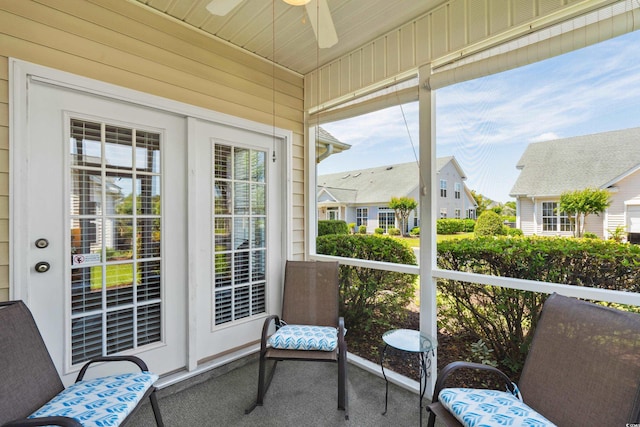 sunroom with plenty of natural light and a ceiling fan
