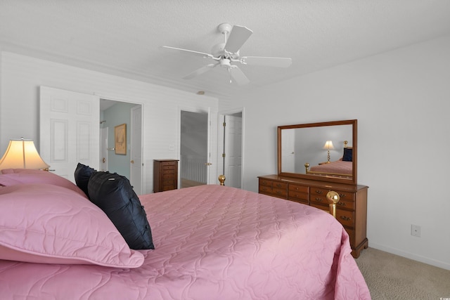 bedroom featuring baseboards, a ceiling fan, and light colored carpet