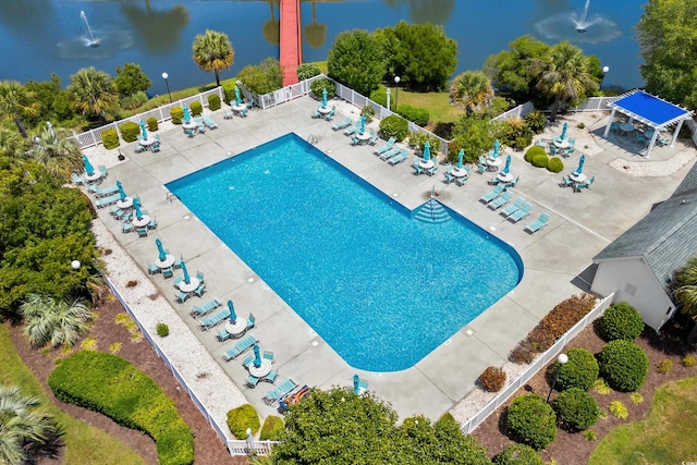 pool with fence and a patio area