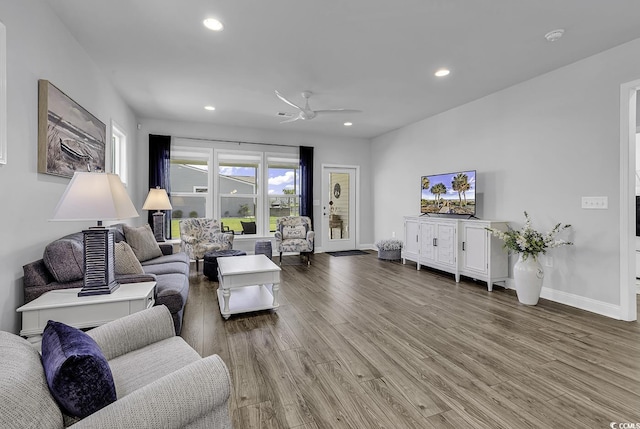living room featuring recessed lighting, baseboards, ceiling fan, and wood finished floors