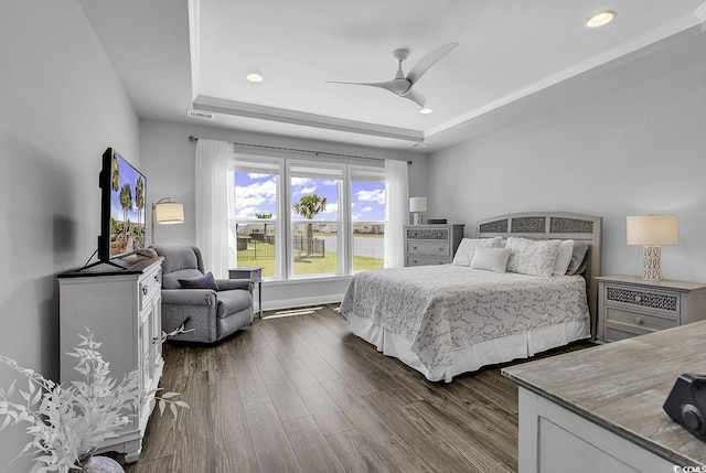 bedroom with ceiling fan, visible vents, a raised ceiling, recessed lighting, and dark wood-type flooring