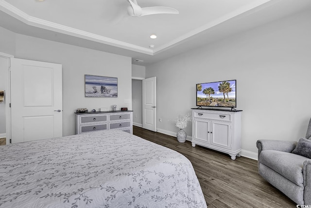 bedroom featuring a raised ceiling, baseboards, a ceiling fan, and dark wood-style floors