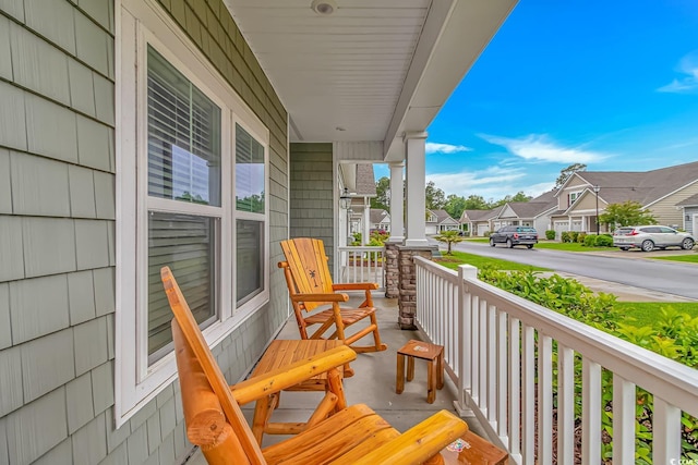 balcony with a residential view and covered porch