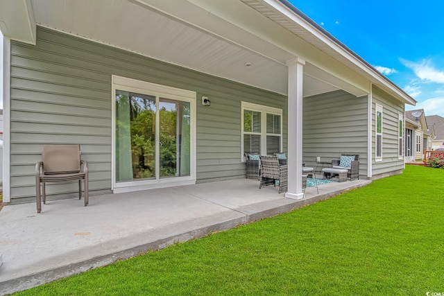 back of property featuring a patio, an outdoor living space, and a yard