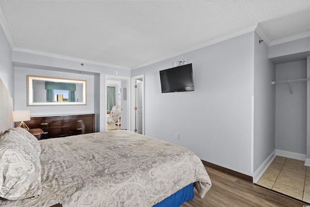 6900 N Ocean Blvd Unit 1105, Myrtle Beach, SC 29572 - bedroom with wood finished floors, ornamental molding, and baseboards