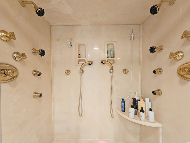 bathroom with a marble finish shower
