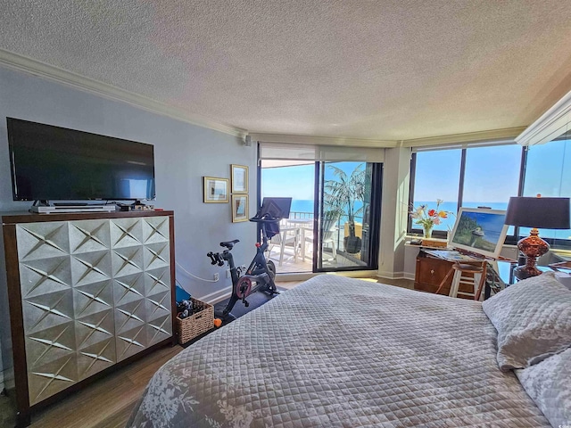 bedroom featuring crown molding, wood finished floors, access to outside, baseboards, and a textured ceiling