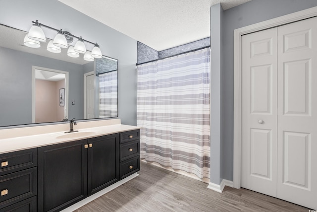5107 Capulet Cir, Myrtle Beach, SC 29588 - full bathroom featuring a textured ceiling, wood finished floors, vanity, and a shower with curtain