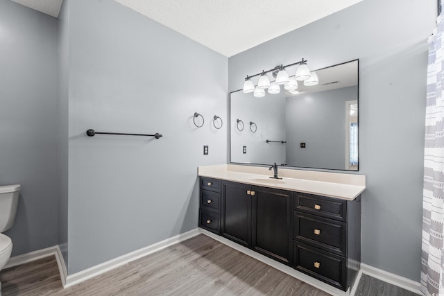 5107 Capulet Cir, Myrtle Beach, SC 29588 - full bath with toilet, baseboards, visible vents, vanity, and wood finished floors