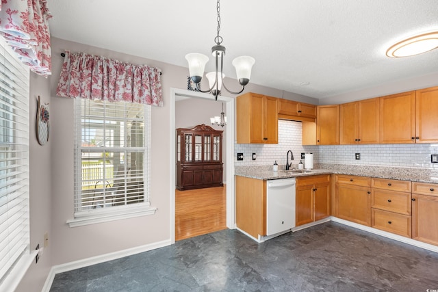 5107 Capulet Cir, Myrtle Beach, SC 29588 - kitchen with a sink, a chandelier, baseboards, dishwasher, and decorative backsplash
