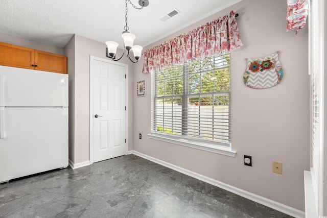 5107 Capulet Cir, Myrtle Beach, SC 29588 - unfurnished dining area featuring a chandelier, visible vents, and baseboards