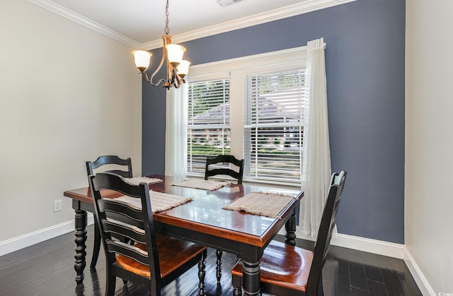 dining space with visible vents, wood finished floors, baseboards, a chandelier, and ornamental molding