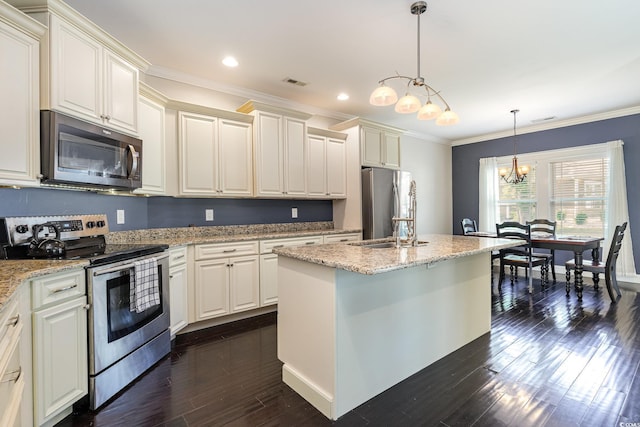kitchen featuring dark wood-style flooring, visible vents, crown molding, appliances with stainless steel finishes, and a notable chandelier