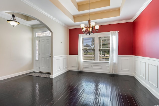 1800 Wood Stork Dr, Conway, SC 29526 - unfurnished dining area with arched walkways, a chandelier, hardwood / wood-style floors, wainscoting, and a raised ceiling
