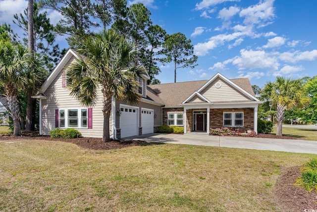 view of front facade featuring driveway, a front lawn, stone siding, and a garage