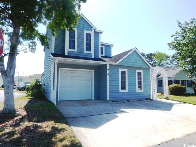 916 Charles St, North Myrtle Beach, SC 29582 - traditional home featuring a garage and concrete driveway