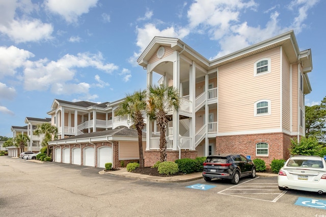 view of building exterior featuring uncovered parking