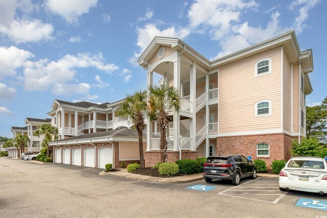 4847 Carnation Cir Unit 201, Myrtle Beach, SC 29577 - view of property featuring uncovered parking