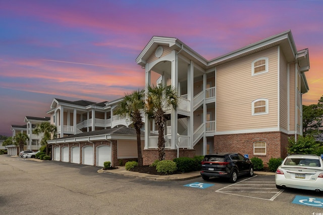 4847 Carnation Cir Unit 201, Myrtle Beach, SC 29577 - property at dusk with uncovered parking