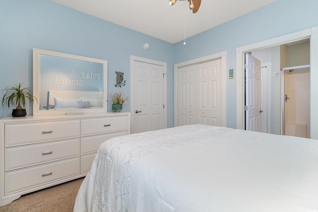 bedroom featuring a ceiling fan, carpet, and a closet