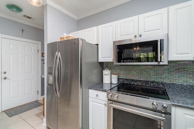 kitchen featuring crown molding, visible vents, white cabinetry, appliances with stainless steel finishes, and backsplash