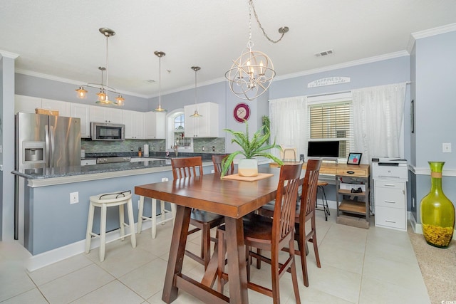dining space with an inviting chandelier, light tile patterned floors, ornamental molding, and visible vents
