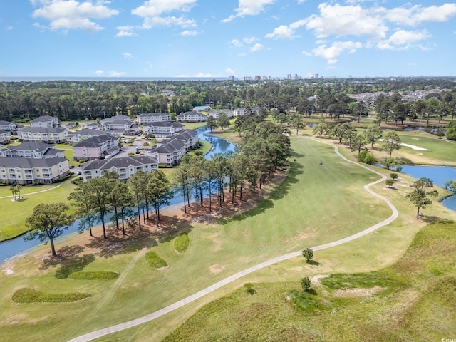 birds eye view of property featuring a water view and view of golf course