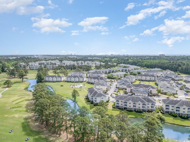 bird's eye view with view of golf course and a water view