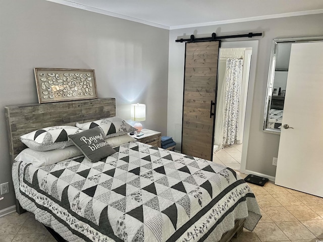 bedroom with crown molding, baseboards, a barn door, and tile patterned flooring
