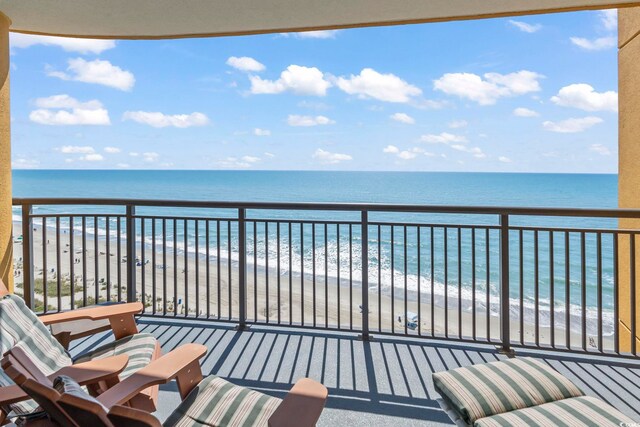 balcony with a beach view and a water view