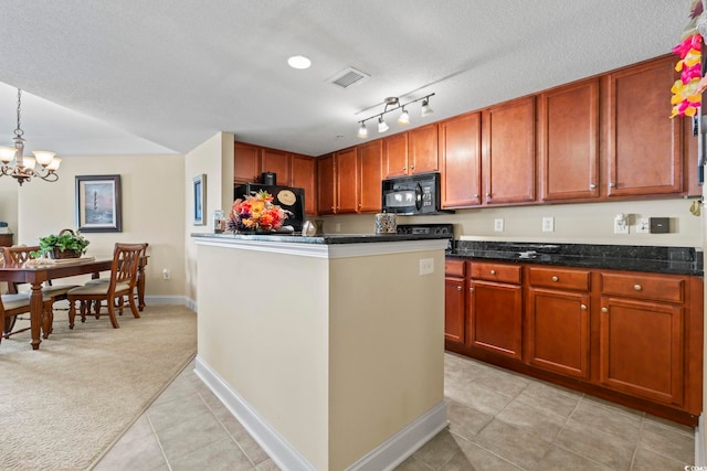 kitchen with visible vents, an inviting chandelier, black microwave, light colored carpet, and light tile patterned floors